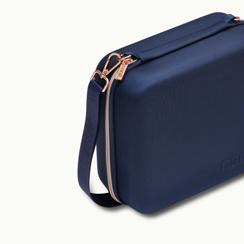 Angled shot of Nanit Traveling Light Case in blue oxford