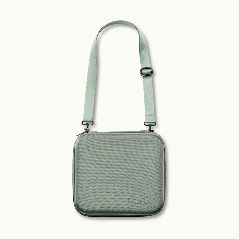 nanit traveling light case with shoulder strap in green oxford