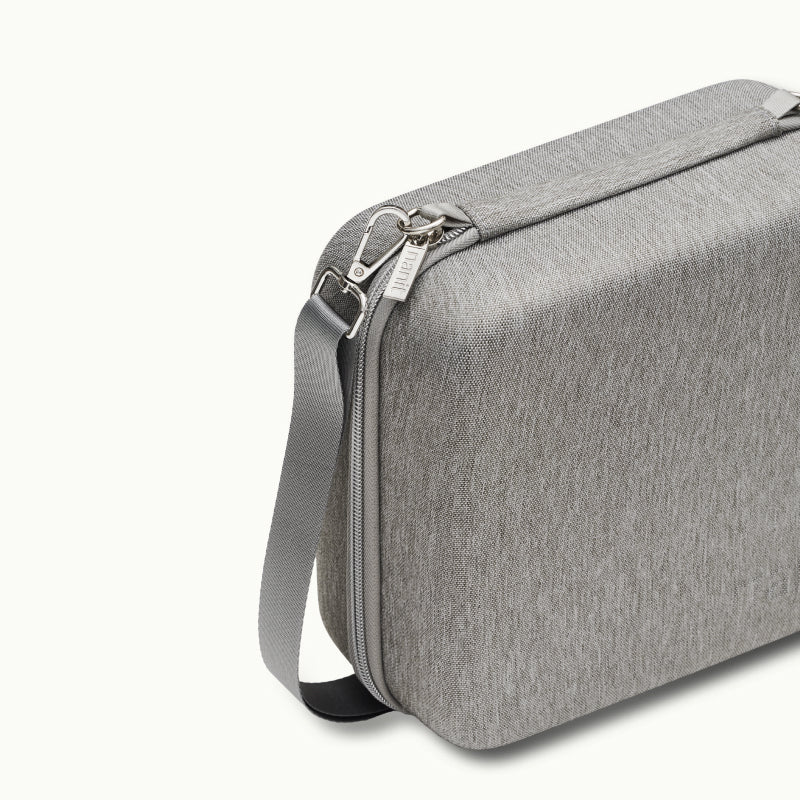 Angled shot of Nanit Traveling Light Case in heather gray oxford