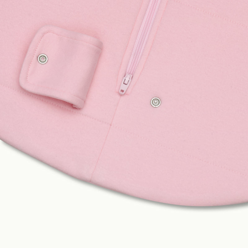 zoomed in on two-way bottom zipper on sleeping bag in rose pink