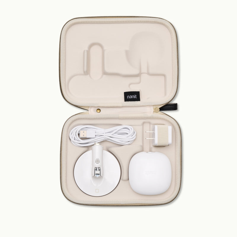 inside nanit travel case in two tone canvas with pro camera, flex stand, and ac adapter 