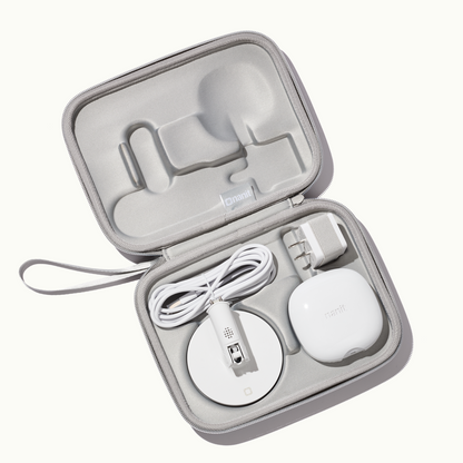 inside nanit travel case in gray with nanit pro camera, flex stand, and power adapter 
